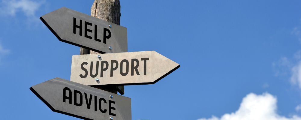 signs with the words, "help," "support" and "advice"