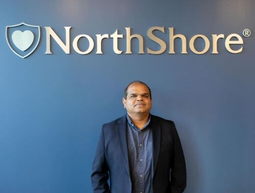 Raj-with-new-northshore-sign-press-release.jpg