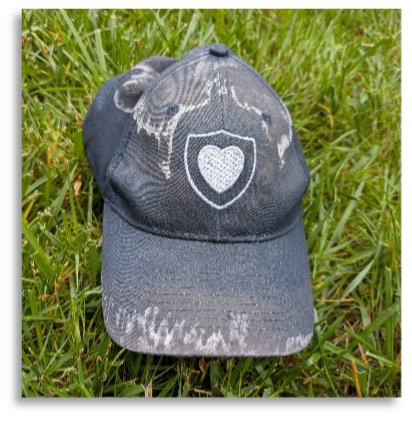 A NorthShore branded hat on the grass