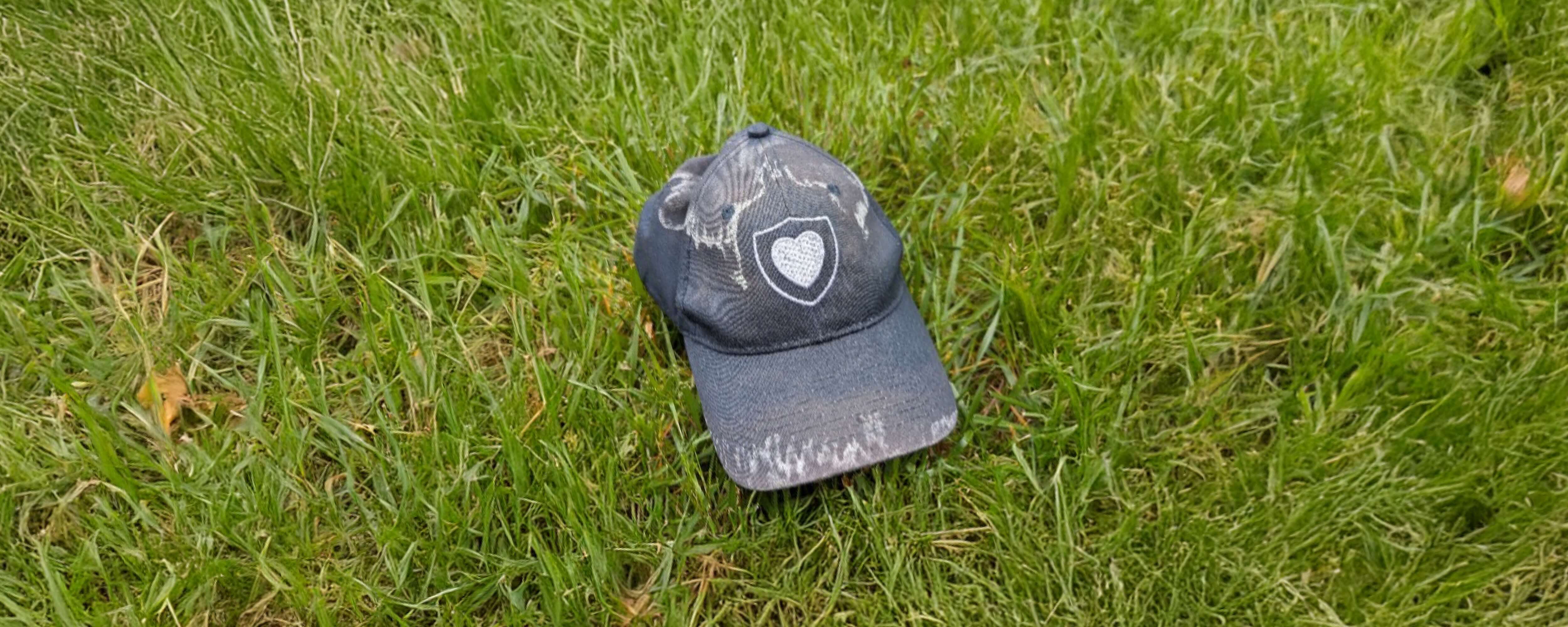 A NorthShore branded hat on the grass